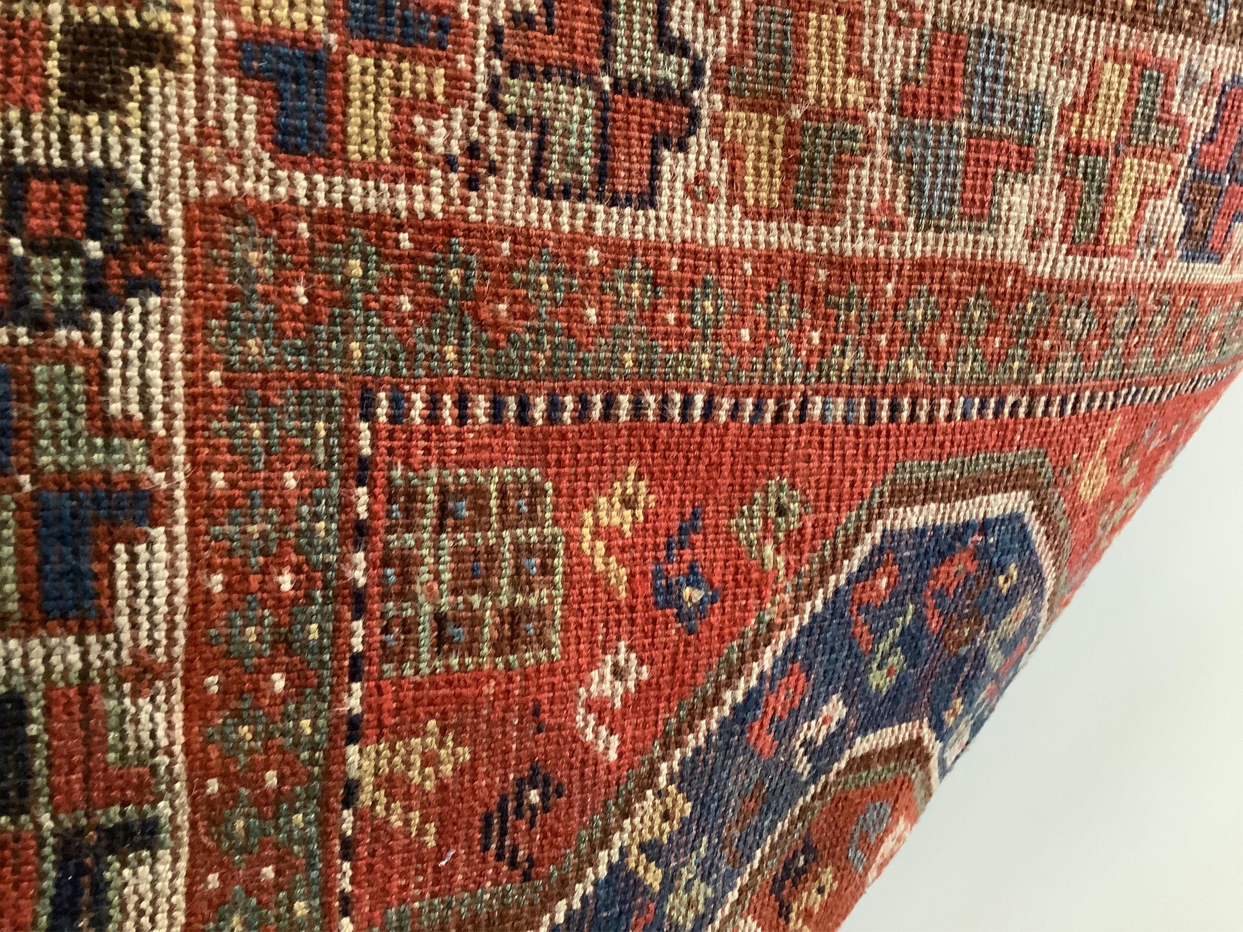 Three assorted Caucasian/ Bokhara rugs, largest 150 x 134cm. Condition - fair